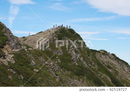 Climbers at the summit of Mt. Senjogatake 92519727