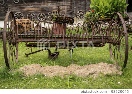 Old rusty rake for hay 92520045