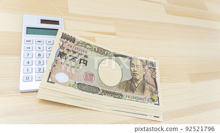 Japanese Yen and Calculator placed on the table 92521796