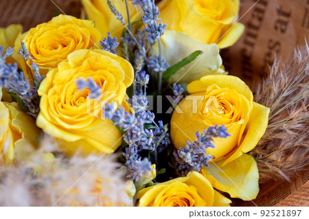 Bouquet of yellow roses and lavender. Floral shop concept 92521897