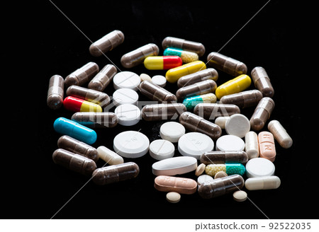Pharmacy. Capsules and tablets dark background. Pharmacy products. Dosage forms. Medical products 92522035
