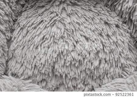 Puffy fabric texture soft toy gray light color abstract material pattern textile close-up background 92522361