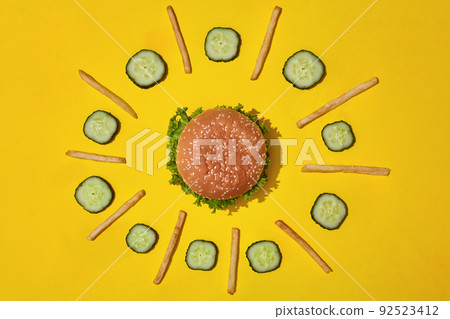 Design concept of mockup burger and french fries set on yellow background. 92523412