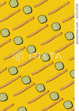 Heap of french fries on yellow background, top view Heap of french fries on yellow background, top view 92523458