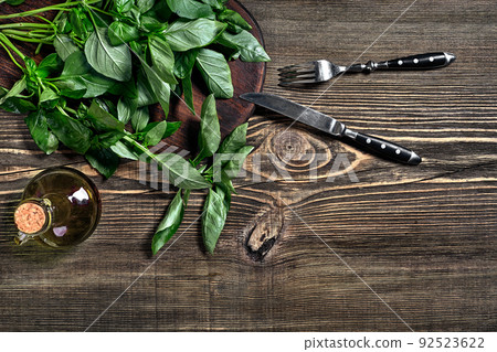 Green fresh basil on wooden background. Top view 92523622