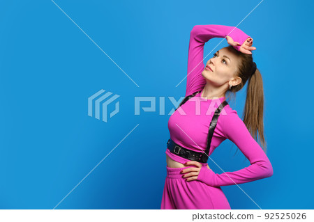 Fashion model in fuchsia knitted suit Fashion model in fuchsia knitted suit 92525026
