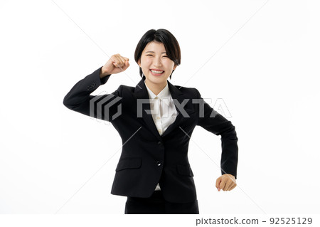 Young business woman in suit on white background 92525129