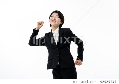 Young business woman in suit on white background 92525131