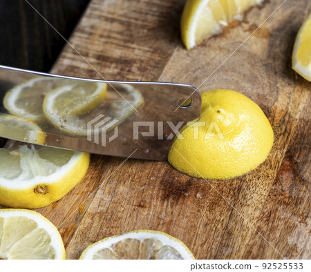 Ripe yellow lemon cut into pieces Ripe yellow lemon cut into pieces 92525533