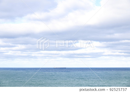 Views on the horizon of a cargo ship sailing. Oil transport concept 92525737