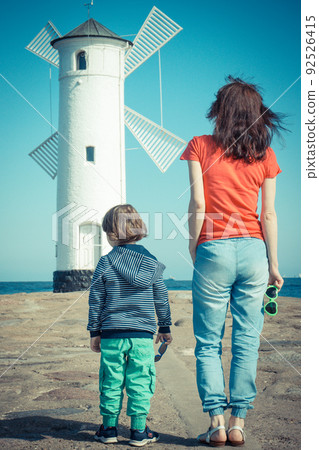 Mom and her son on west breakwater in Swinoujscie 92526415