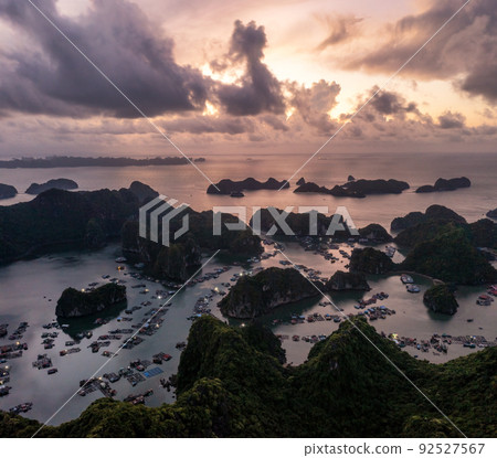 Floating fishing village and rock island in " Lan Ha " Bay, Vietnam, Southeast Asia Floating fishing village and rock island in " Lan Ha " Bay, Vietnam, Southeast Asia 92527567