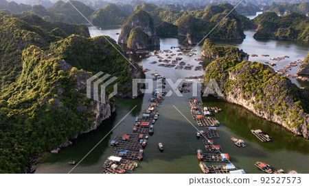 Floating fishing village and rock island in " Lan Ha " Bay, Vietnam, Southeast Asia Floating fishing village and rock island in " Lan Ha " Bay, Vietnam, Southeast Asia 92527573