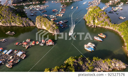Floating fishing village and rock island in " Lan Ha " Bay, Vietnam, Southeast Asia 92527576