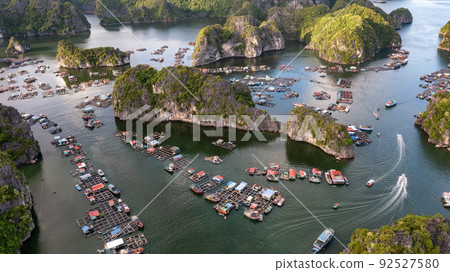 Floating fishing village and rock island in " Lan Ha " Bay, Vietnam, Southeast Asia Floating fishing village and rock island in " Lan Ha " Bay, Vietnam, Southeast Asia 92527580
