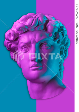 Gypsum copy of head statue David in bright neon colors for artists on a color background. Face famous sculpture youth of David by Michelangelo. Template design for dj, fashion, poster, zine, collage. Gypsum copy of head statue David in bright neon colors for artists on a color background. Face famous sculpture youth of David by Michelangelo. Template design for dj, fashion, poster, zine, collage. 92529245