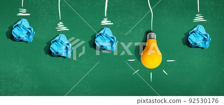 Brainstorming concept with crumpled paper light bulbs Brainstorming concept with crumpled paper light bulbs 92530176