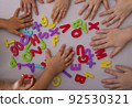 Kids learning alphabet letters. Top view, education concept 92530321