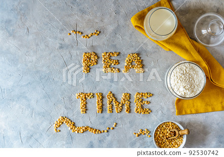 Healthy pea products - vegan plant-based pea milk, flour and seeds. Concrete background, Mockup for text Healthy pea products - vegan plant-based pea milk, flour and seeds. Concrete background, Mockup for text 92530742