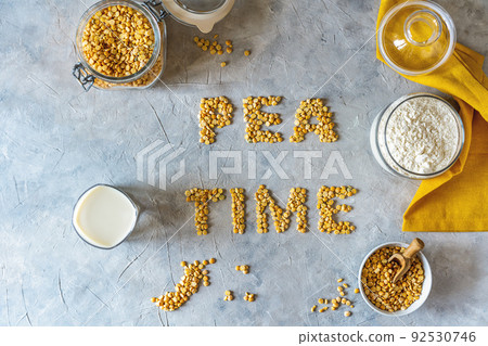 Healthy pea products - vegan plant-based pea milk, flour and seeds. Concrete background, Mockup for text Healthy pea products - vegan plant-based pea milk, flour and seeds. Concrete background, Mockup for text 92530746