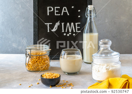 Healthy pea products - milk, flour and seeds. Concrete background, Mockup for text Healthy pea products - milk, flour and seeds. Concrete background, Mockup for text 92530747