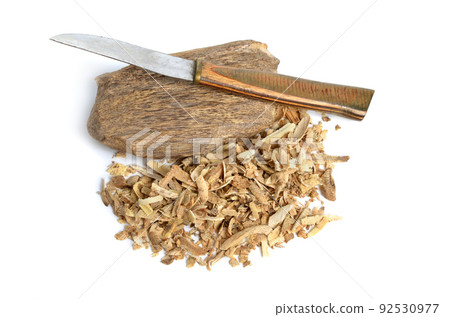 Agarwood, aloeswood, eaglewood or gharuwood. Piece of wood and shavings. Isolated. Agarwood, aloeswood, eaglewood or gharuwood. Piece of wood and shavings. Isolated. 92530977