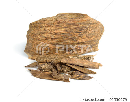 Agarwood, aloeswood, eaglewood or gharuwood. Piece of wood and shavings. Isolated. 92530979