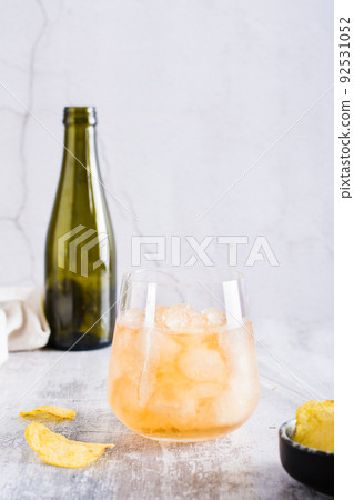 Beer slush in a glass on the table. Frozen summer drink. Vertical view 92531052