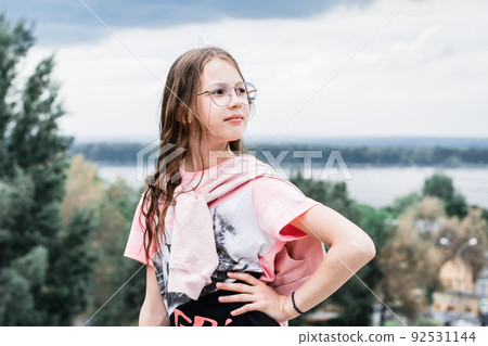Portrait of a self-confident girl in glasses with long hair. Content for social networks Portrait of a self-confident girl in glasses with long hair. Content for social networks 92531144