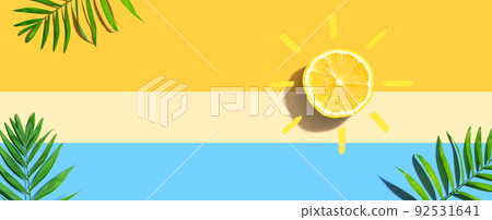 Summer concept with lemon sunlight with palm leaves Summer concept with lemon sunlight with palm leaves 92531641
