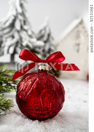 Christmas red baubles on snow with free tree branches Christmas red baubles on snow with free tree branches 92531661