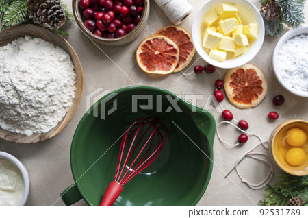 Cooking Christmas cookies. Top view of empty bowl and baking ingredients eggs, flour, butter. Step by step recipe. 92531789