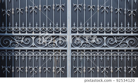 Forged patterned lattice on the gate of the house. Lattice with monograms and spades on a massive gate. Biting business. Production of iron decor. Full screen photo Forged patterned lattice on the gate of the house. Lattice with monograms and spades on a massive gate. Biting business. Production of iron decor. Full screen photo 92534120