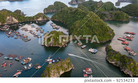 Floating fishing village and rock island in " Lan Ha " Bay, Vietnam, Southeast Asia Floating fishing village and rock island in " Lan Ha " Bay, Vietnam, Southeast Asia 92534233