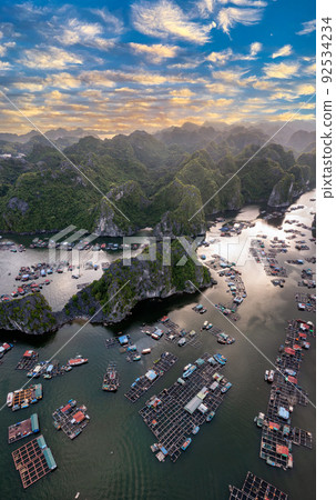 Floating fishing village and rock island in " Lan Ha " Bay, Vietnam, Southeast Asia Floating fishing village and rock island in " Lan Ha " Bay, Vietnam, Southeast Asia 92534234