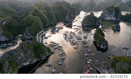 Floating fishing village and rock island in " Lan Ha " Bay, Vietnam, Southeast Asia Floating fishing village and rock island in " Lan Ha " Bay, Vietnam, Southeast Asia 92534235