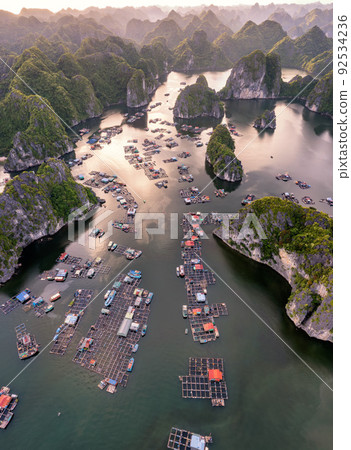 Floating fishing village and rock island in " Lan Ha " Bay, Vietnam, Southeast Asia Floating fishing village and rock island in " Lan Ha " Bay, Vietnam, Southeast Asia 92534236