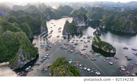 Floating fishing village and rock island in " Lan Ha " Bay, Vietnam, Southeast Asia 92534238
