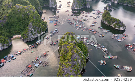 Floating fishing village and rock island in " Lan Ha " Bay, Vietnam, Southeast Asia Floating fishing village and rock island in " Lan Ha " Bay, Vietnam, Southeast Asia 92534239