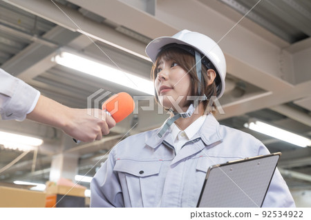 Interview: A woman working in a factory Interview: A woman working in a factory 92534922