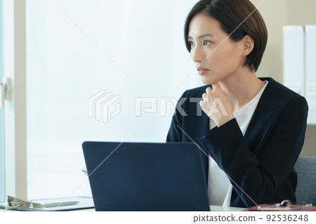 Career women heading to a computer Career women heading to a computer 92536248