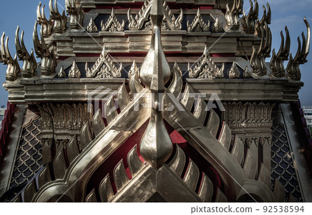 Symmetry view of Loha Prasart Metal Palace at Ratchanaddaram temple through the gate. Loha Prasat Metal Palace is famous tourist destination in Bangkok. Symmetry view of Loha Prasart Metal Palace at Ratchanaddaram temple through the gate. Loha Prasat Metal Palace is famous tourist destination in Bangkok. 92538594