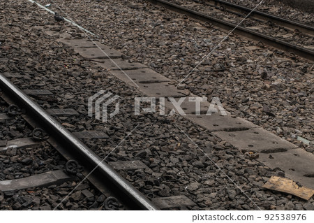 Railroad crossing through in railway station. Railroad crossing through in railway station. 92538976