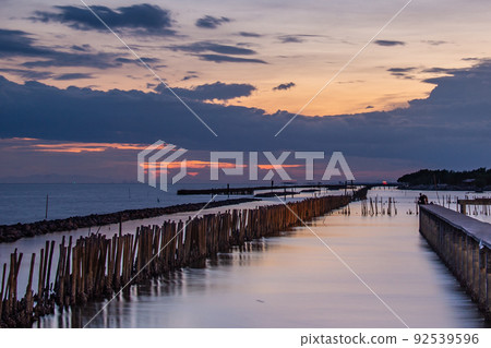Beautiful of The walkway bridge in evening at Bang Khun Thian sea view, Bang Khun Thian, Bangkok. 92539596
