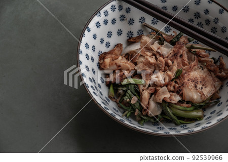 Stir fried flat noodle and Chicken with dark soy sauce and vegetables (Thai people called Pad See Ew), It is one of the most popular street food in the world. Stir fried flat noodle and Chicken with dark soy sauce and vegetables (Thai people called Pad See Ew), It is one of the most popular street food in the world. 92539966