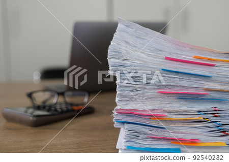 business administration and data documents on office desk, Stack of business overload paper. 92540282
