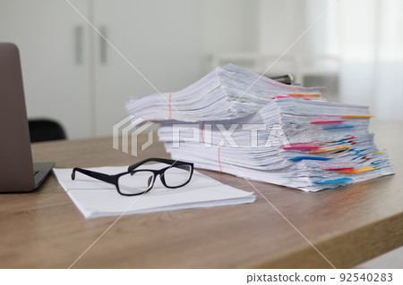 Business Documents concept  document achieves on folders papers at busy work desk office 92540283