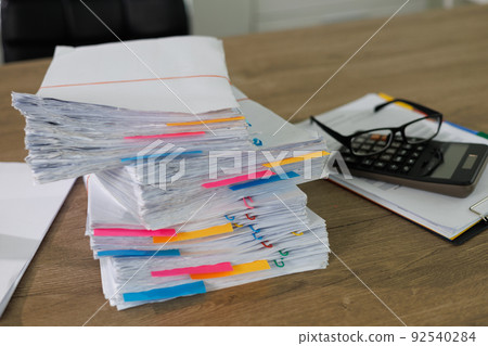 business administration and data documents on office desk, Stack of business overload paper. 92540284