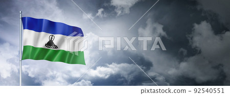 Lesotho flag on a cloudy sky 92540551