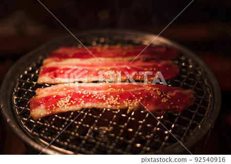 Grilling wagyu beef on charcoal grill Grilling wagyu beef on charcoal grill 92540916